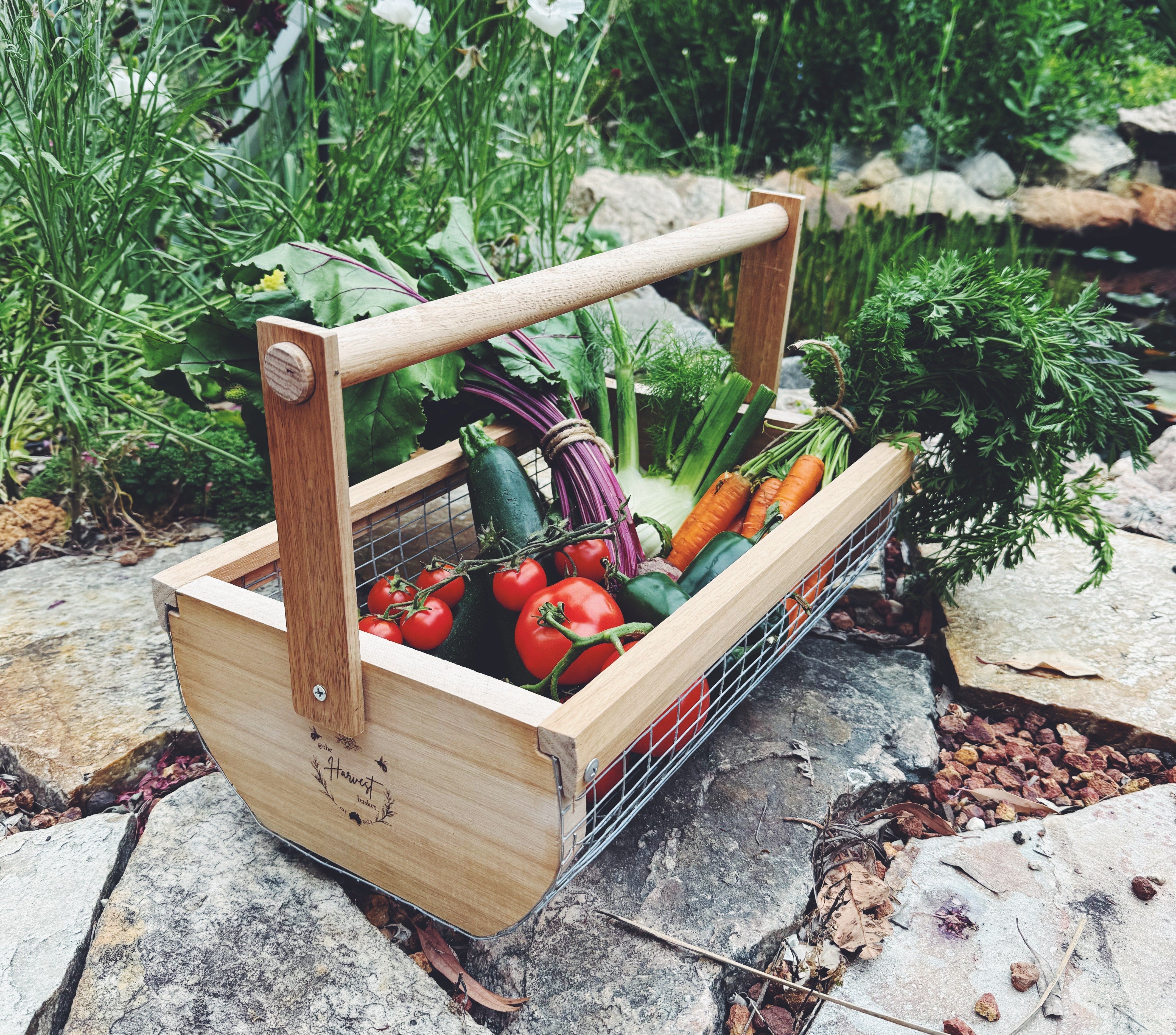 
The Harvest Basket filled with fresh vegetables in a garden setting